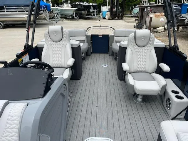 Slide: The Image of 2024 Godfrey Monaco 235 SB boat interior with luxurious seating and modern design. - 11