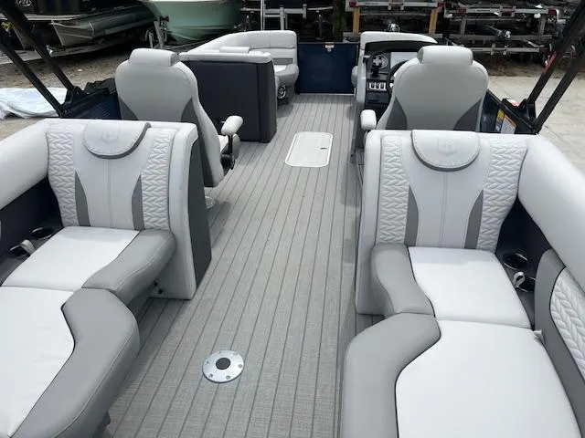 Slide: The Image of 2024 Godfrey Monaco 235 SB boat interior with luxurious seating and modern design. - 14