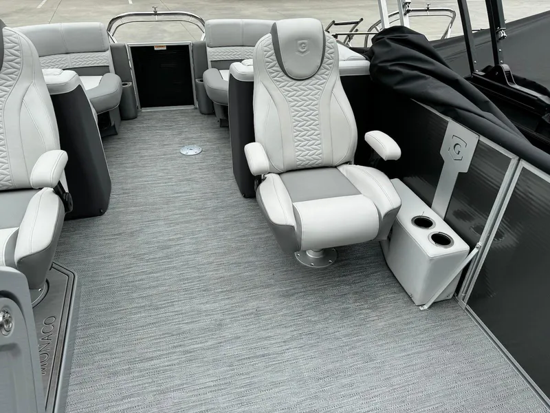 Slide: The Image of 2024 Godfrey Monaco 235 SB boat interior with plush seating and modern design. - 10