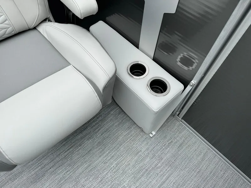 Slide: The Image of Luxurious seating with dual cup holders in 2024 Godfrey Monaco 235 SB boat. - 11