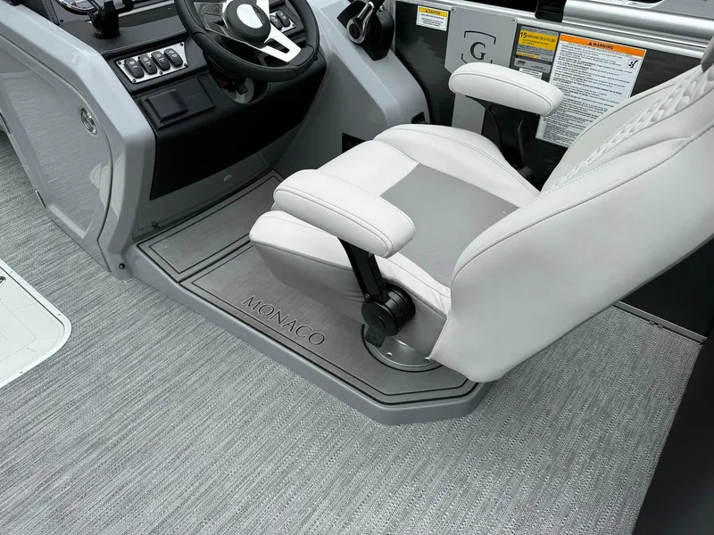 Slide: The Image of Captain's chair and helm of 2024 Godfrey Monaco 235 SB boat. - 13