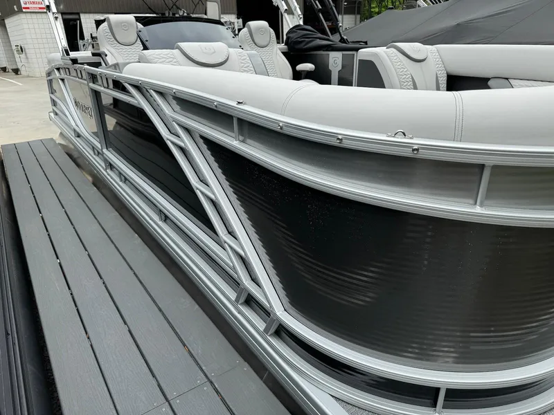 Slide: The Image of 2024 Godfrey Monaco 235 SB pontoon boat with sleek design and luxurious seating. - 3