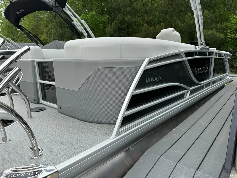 Slide: The Image of 2024 Godfrey Monaco 235 SB pontoon boat with sleek design and modern features. - 4