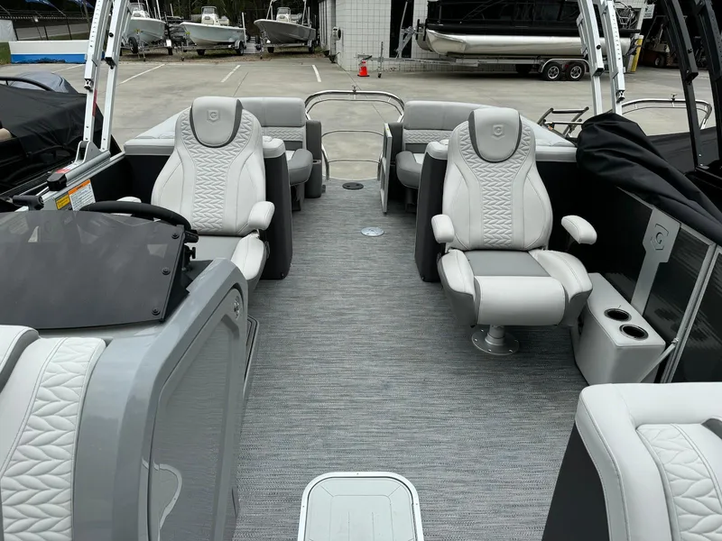 Slide: The Image of 2024 Godfrey Monaco 235 SB boat interior with luxurious seating and modern design. - 9