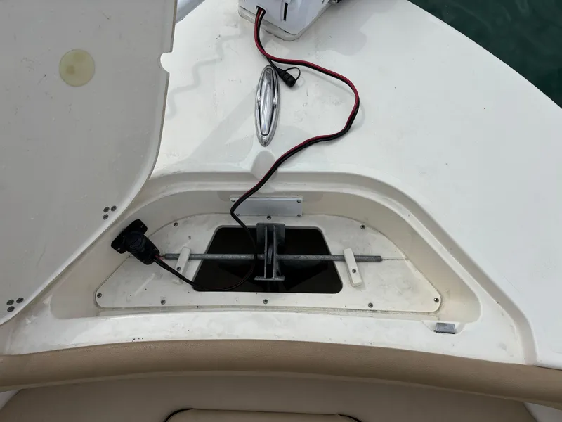 Slide: The Image of 2021 Scout 215XSF boat compartment with wiring and open hatch. - 18