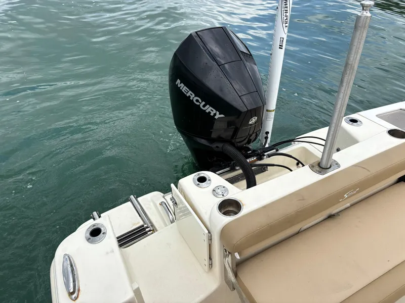 Slide: The Image of 2021 Scout 215XSF boat with Mercury outboard motor on water. - 33