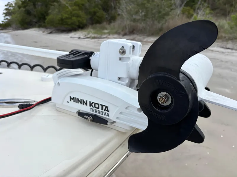 Slide: The Image of Minn Kota Terrova motor on 2021 Scout 215XSF boat, beach background. - 49