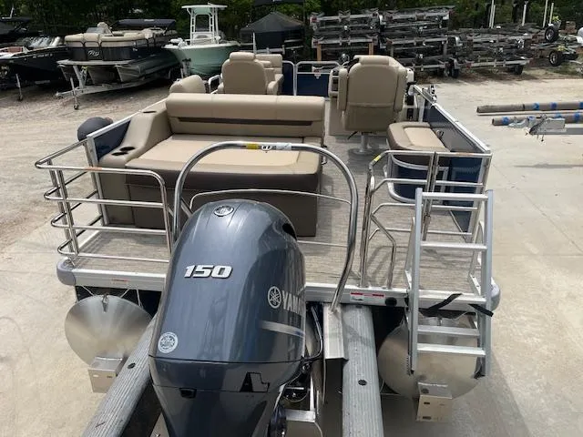 Slide: The Image of 2023 Godfrey SWEETWATER 2286 SFL pontoon boat with Yamaha 150 engine, beige seating. - 4