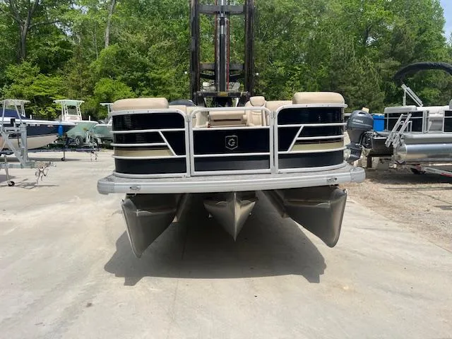 Slide: The Image of 2023 Godfrey SWEETWATER 2286 SFL pontoon boat on a concrete surface. - 1