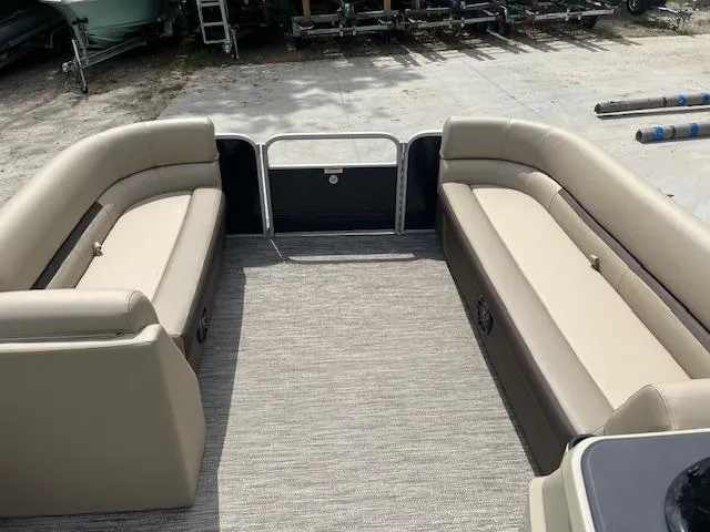 Slide: The Image of 2023 Godfrey SWEETWATER 2286 SFL pontoon boat interior with beige seating. - 5