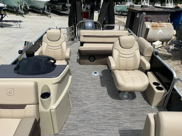 Slide: The Image of 2023 Godfrey SWEETWATER 2286 SFL pontoon boat with beige seating and modern interior design. - 6