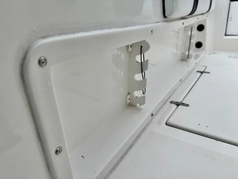Slide: The Image of Interior view of a 2022 Thresher 25 CC boat, showcasing storage compartment details. - 16