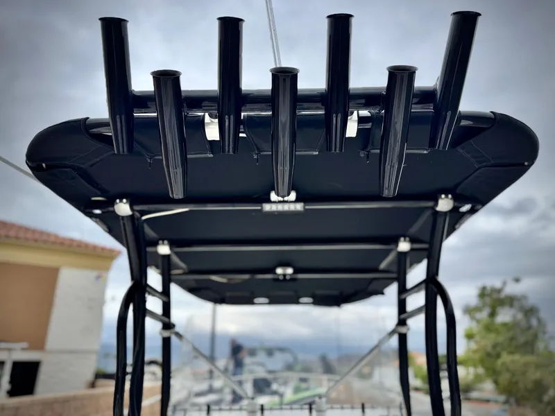 Slide: The Image of T-top of 2022 Thresher 25 CC boat with rod holders, viewed from below. - 25