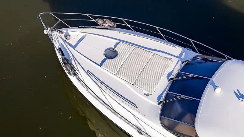 Slide: The Image of 1997 Viking Princess 60 Flybridge yacht, aerial view of deck and railings. - 10