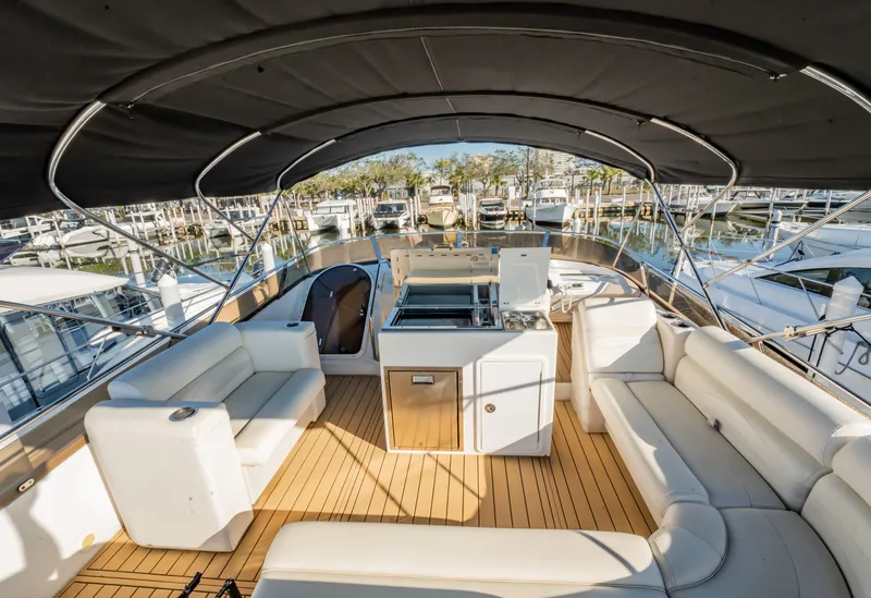 Slide: The Image of Luxurious 1997 Viking Princess 60 Flybridge yacht with spacious seating and elegant design. - 12