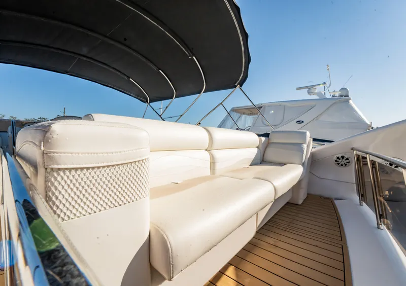 Slide: The Image of Luxurious 1997 Viking Princess 60 Flybridge yacht with spacious seating and elegant design. - 15