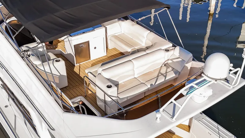 Slide: The Image of 1997 Viking Princess 60 Flybridge yacht with spacious seating and elegant design. - 17