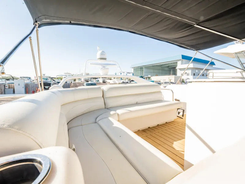 Slide: The Image of Luxurious 1997 Viking Princess 60 Flybridge yacht with spacious seating and elegant design. - 18