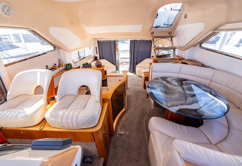 Slide: The Image of Luxurious 1997 Viking Princess 60 Flybridge interior with plush seating and elegant design. - 26