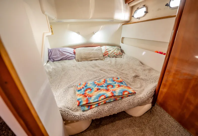 Slide: The Image of Cozy bedroom in 1997 Viking Princess 60 Flybridge yacht with colorful blanket. - 32