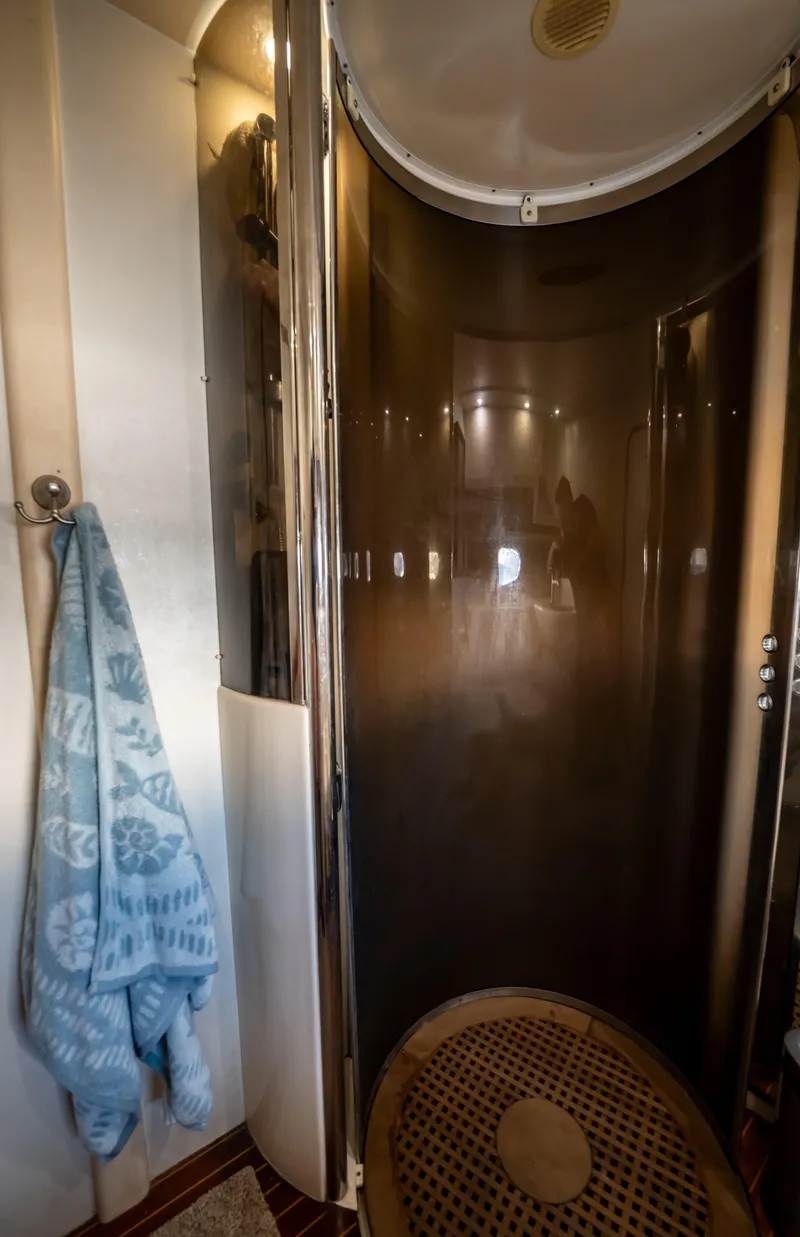 Slide: The Image of Shower area in 1997 Viking Princess 60 Flybridge yacht with towel hanging. - 36