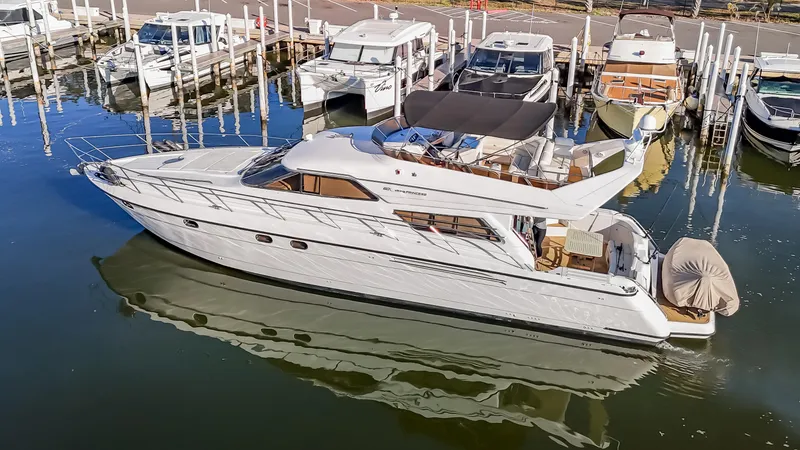 Slide: The Image of 1997 Viking Princess 60 Flybridge yacht docked in marina, aerial view. - 4
