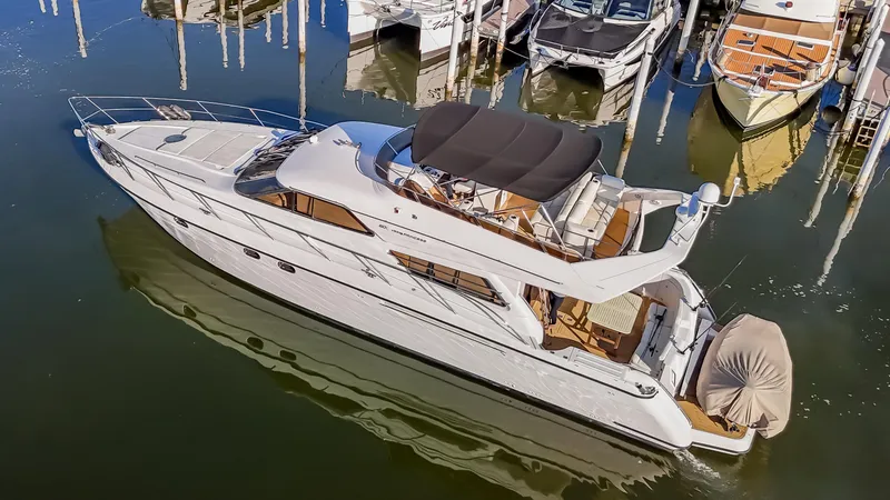 Slide: The Image of 1997 Viking Princess 60 Flybridge yacht docked in marina, aerial view. - 6