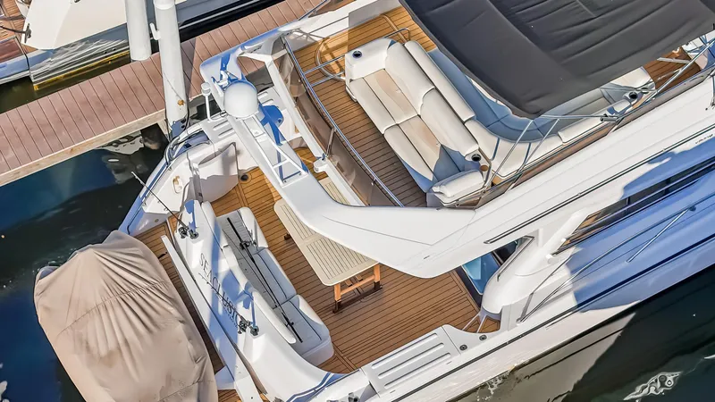 Slide: The Image of Aerial view of 1997 Viking Princess 60 Flybridge yacht with spacious deck and seating area. - 7