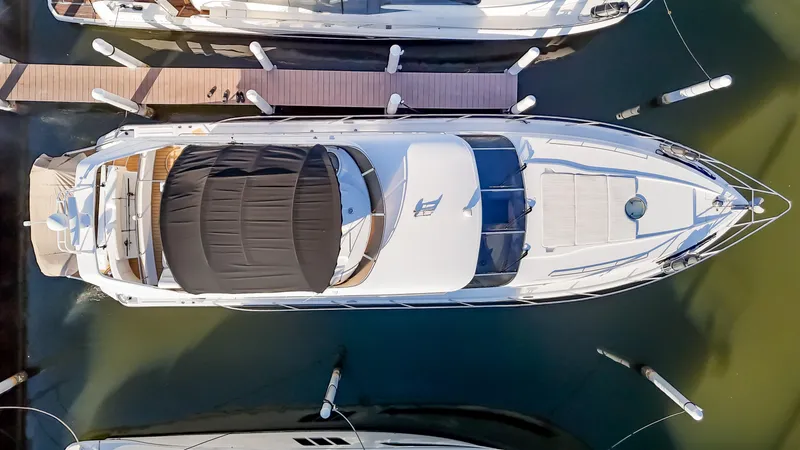 Slide: The Image of Aerial view of 1997 Viking Princess 60 Flybridge yacht docked at marina. - 8