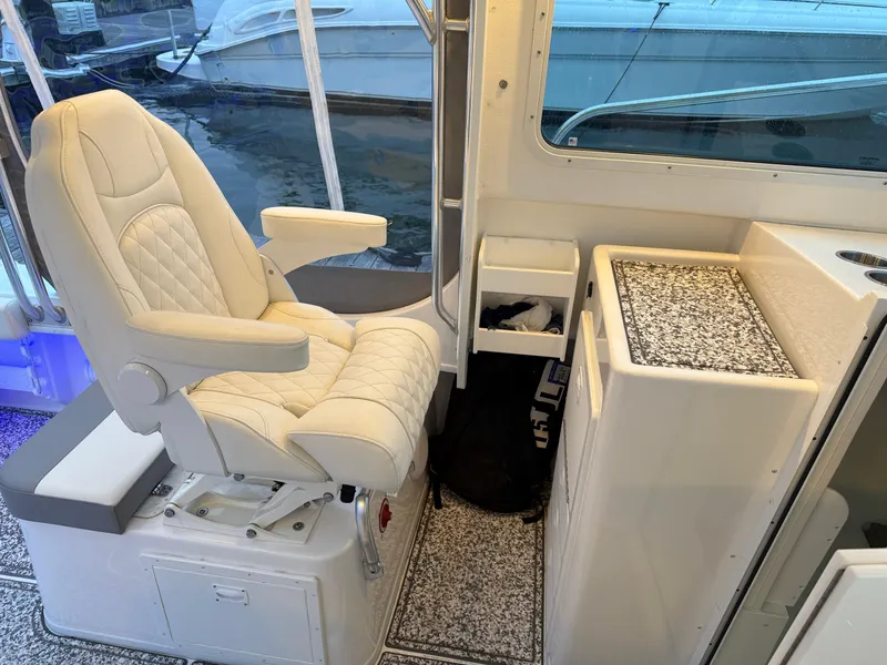 Slide: The Image of Luxurious interior of 2024 Steiger Craft 28 Peconic boat with plush seating. - 10