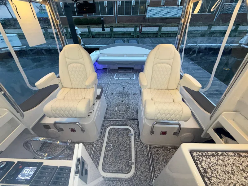 Slide: The Image of 2024 Steiger Craft 28 Peconic boat interior with luxurious seating and modern design. - 11