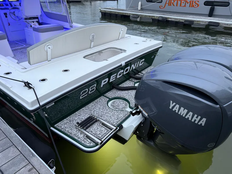 Slide: The Image of 2024 Steiger Craft 28 Peconic boat with Yamaha engines docked at marina. - 3