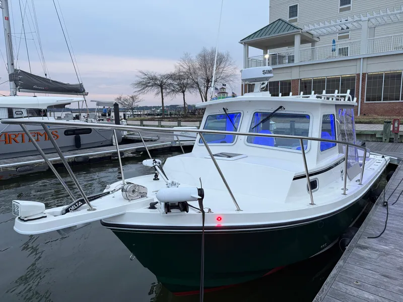 Slide: The Image of 2024 Steiger Craft 28 Peconic boat docked at marina, evening view. - 5