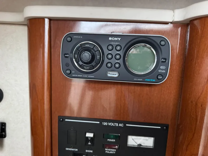 Slide: The Image of Sony stereo system on 2009 Sea Ray 240 Sundancer boat dashboard. - 21