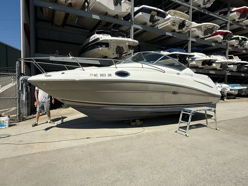 Slide: The Image of 2009 Sea Ray 240 Sundancer boat in storage facility, side view. - 8