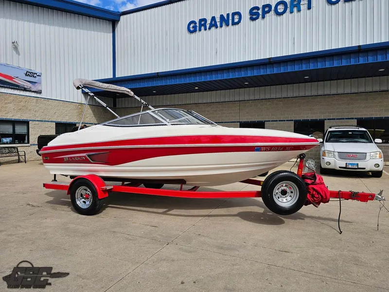 Slide: The Image of 2010 Larson Senza 186 boat on trailer outside Grand Sport Center. - 12