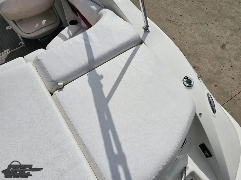 Slide: The Image of 2010 Larson Senza 186 boat interior with white seating and deck details. - 37