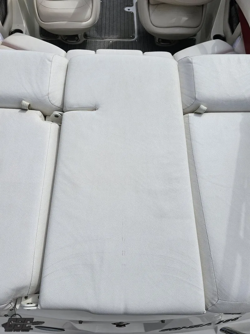 Slide: The Image of 2010 Larson Senza 186 boat interior with white cushioned seating. - 38