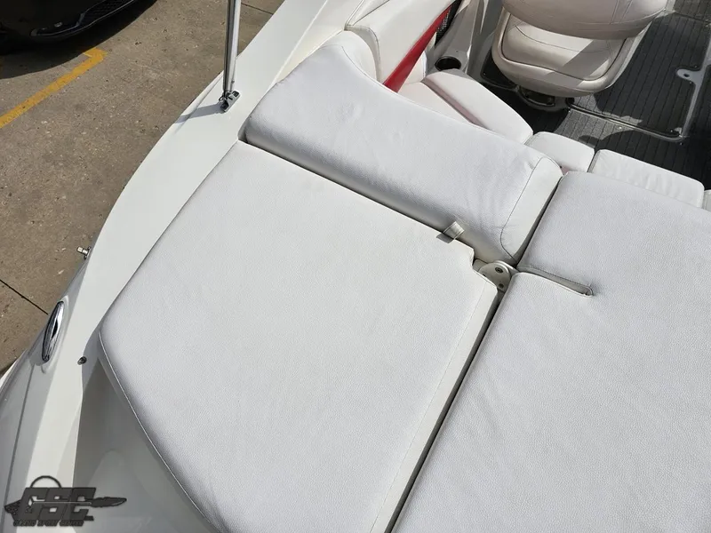 Slide: The Image of 2010 Larson Senza 186 boat with white cushioned seating and sleek design. - 39