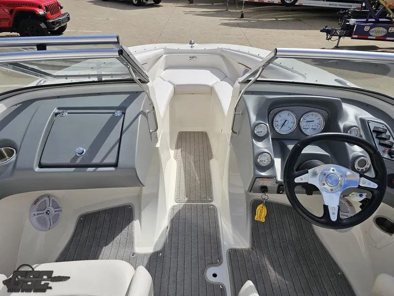 Slide: The Image of 2010 Larson Senza 186 boat interior with steering wheel and dashboard controls. - 43