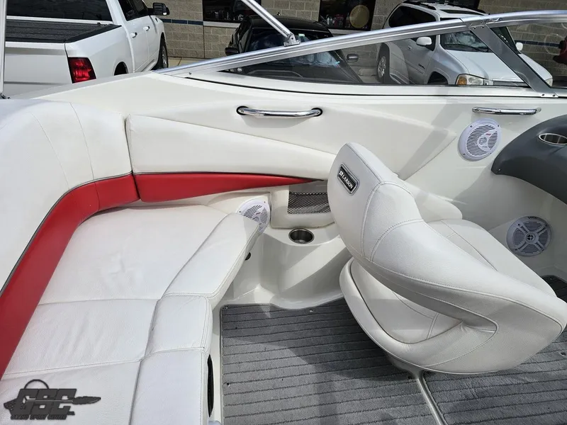Slide: The Image of Interior of a 2010 Larson Senza 186 boat with white and red seating. - 46