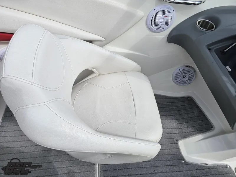 Slide: The Image of 2010 Larson Senza 186 boat interior with white seat and speakers. - 49
