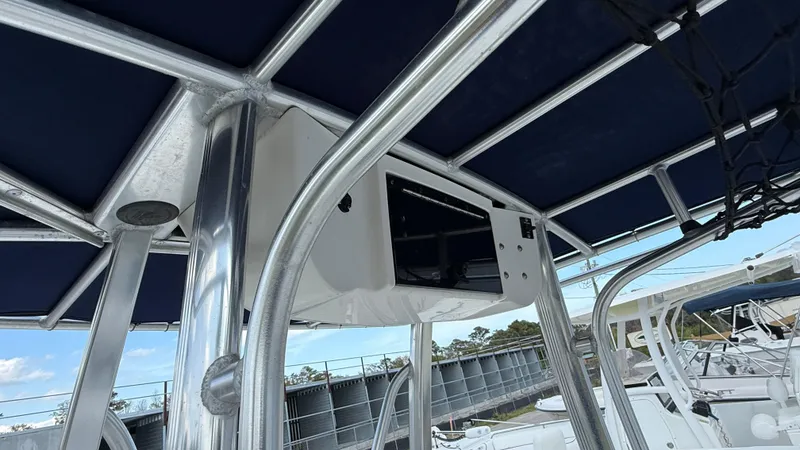 Slide: The Image of 2010 Sea Hunt Ultra 210 boat with T-top and electronics box. - 12