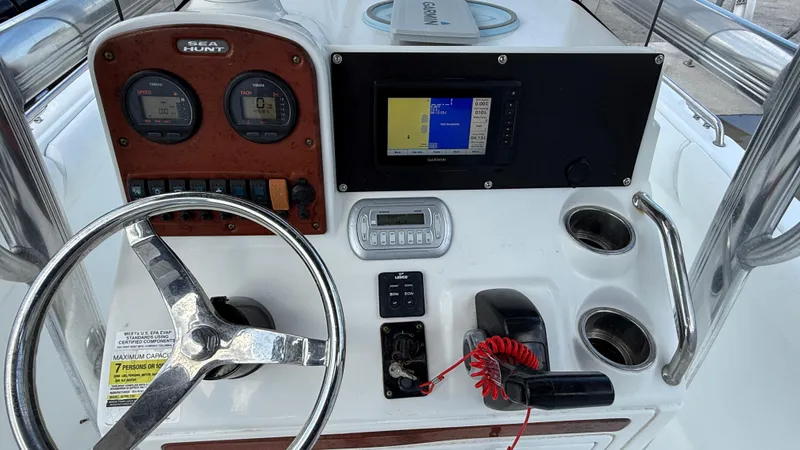 Slide: The Image of Steering console of a 2010 Sea Hunt Ultra 210 boat with navigation equipment. - 21