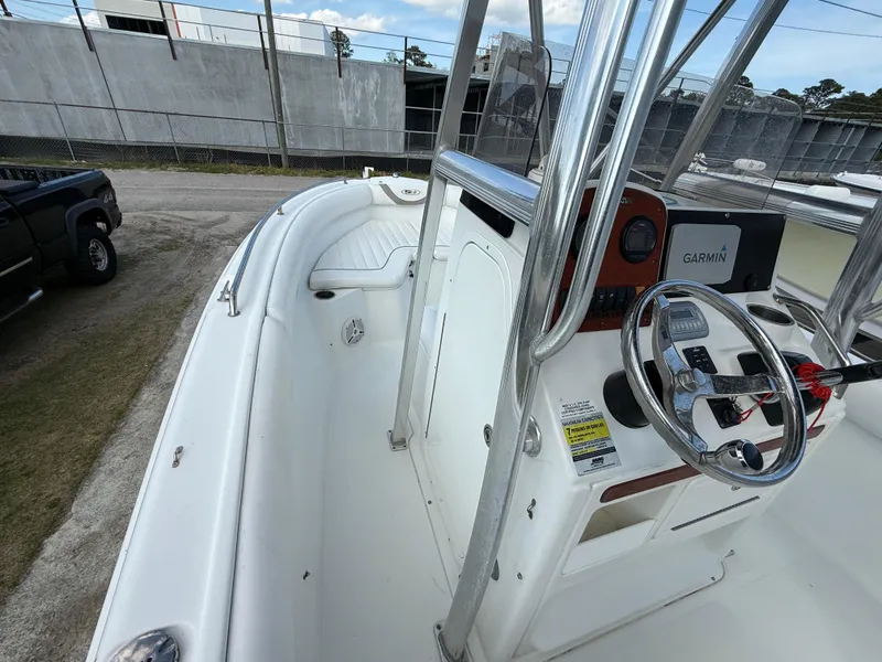 Slide: The Image of 2010 Sea Hunt Ultra 210 boat interior with steering wheel and Garmin navigation system. - 33