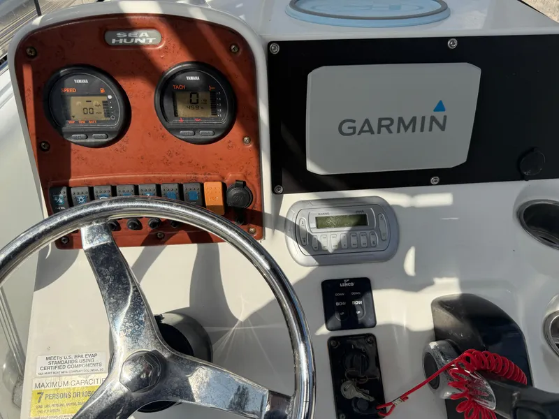 Slide: The Image of Control panel of a 2010 Sea Hunt Ultra 210 boat with Garmin navigation system. - 36