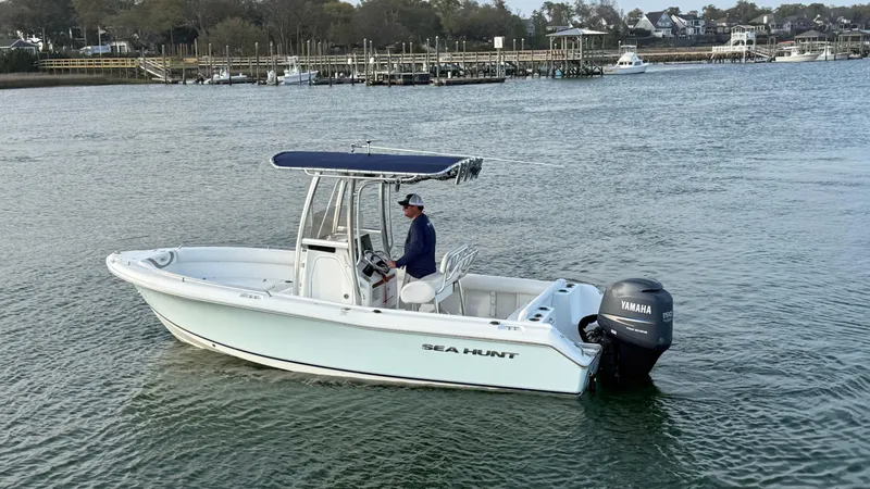 Slide: The Image of 2010 Sea Hunt Ultra 210 boat with Yamaha engine on calm water. - 46