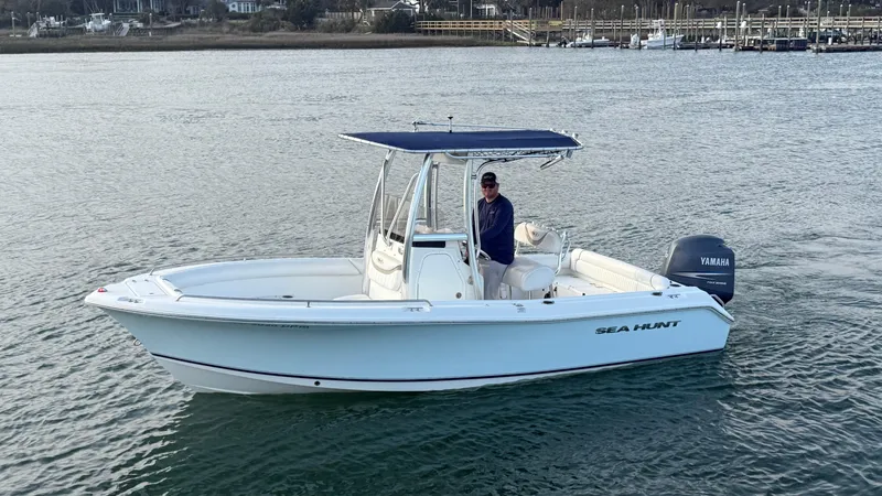 Slide: The Image of 2010 Sea Hunt Ultra 210 boat with Yamaha engine on calm water. - 47