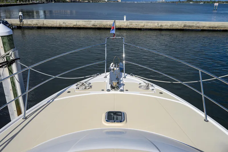 Slide: The Image of 2018 Sabre 48 Salon Express yacht bow view at marina. - 17
