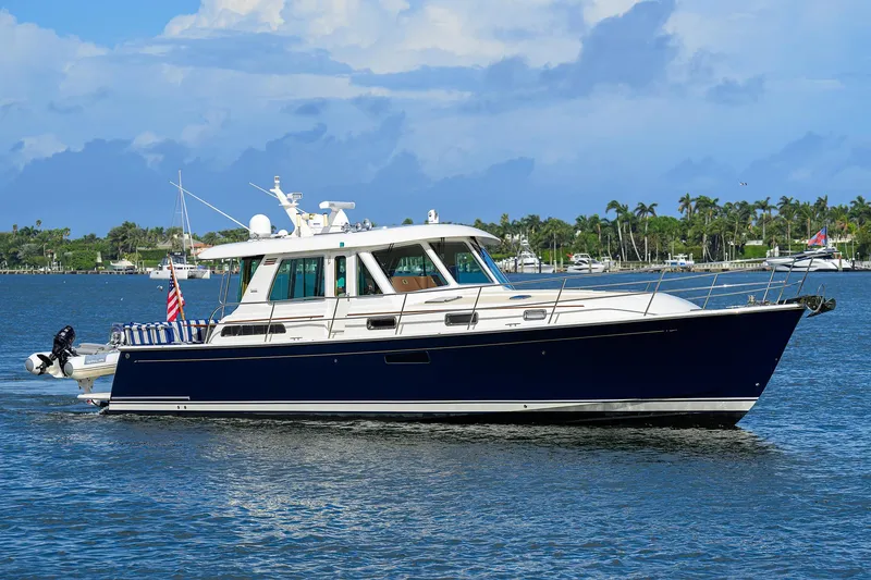 Slide: The Image of 2018 Sabre 48 Salon Express yacht cruising on a sunny day. - 4